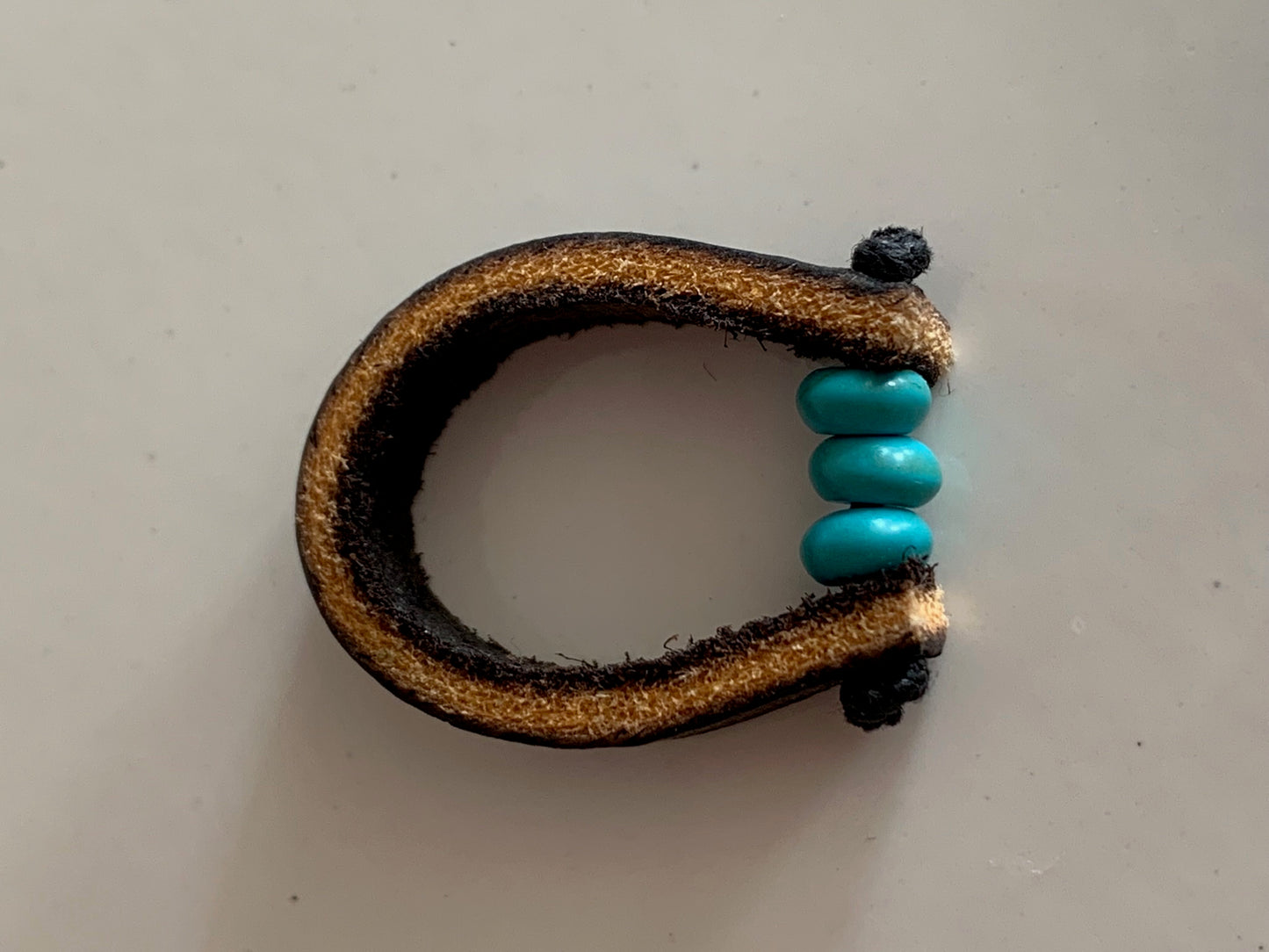 Turquoise and leather ring